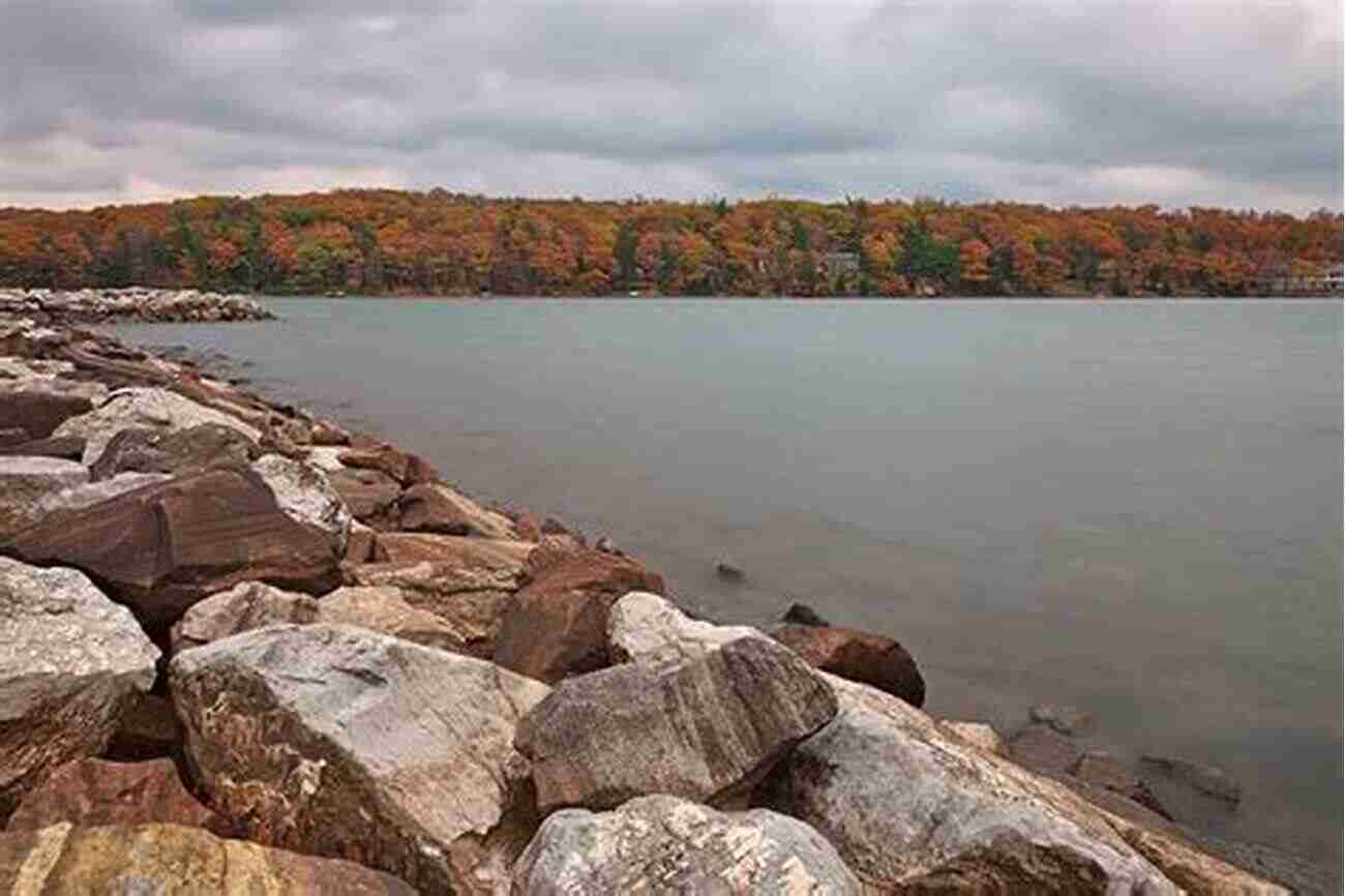 A Breathtaking View Of Deep Creek Lake Surrounded By Tall Mountains And Trees The Realm Of Deep Creek Lake