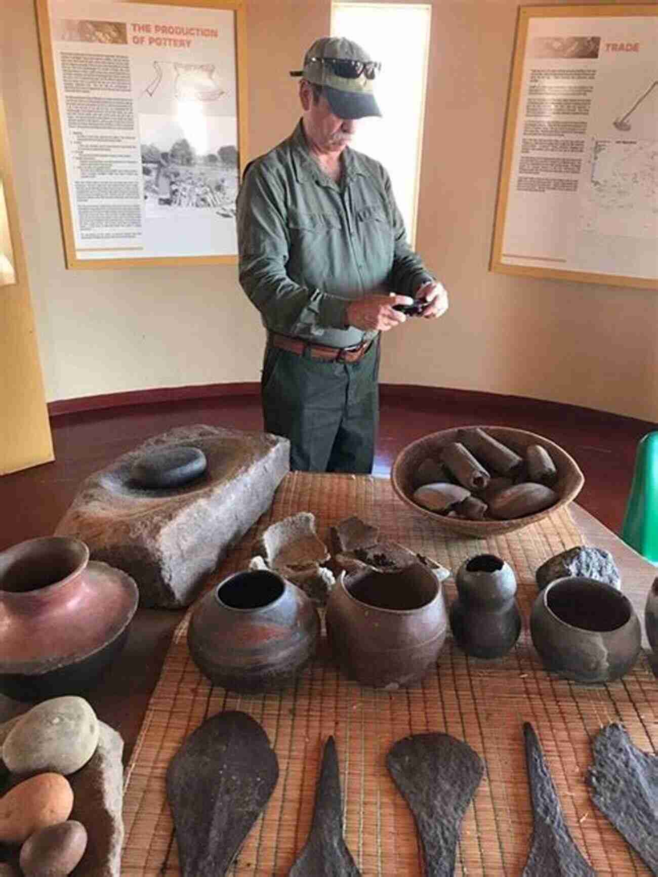 A Group Of Historians Examining Artifacts In A Museum The Great Olmec Civilizations: Studying The History Its Culture: When Did The Olmec Civilization Begin