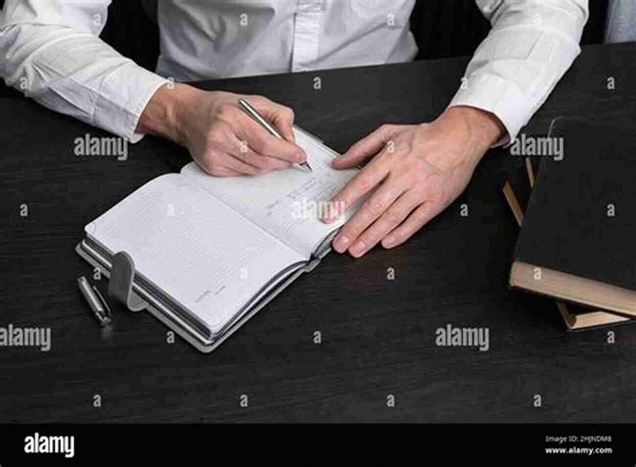 A Person Holding A Planner And Pen, While Sitting At A Desk Tea House Treks Of Nepal: A Beginner S Guide To Planning And Preparing