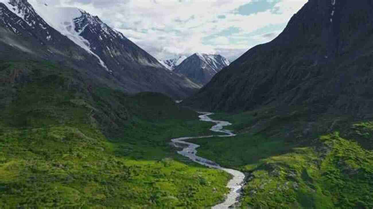 A Scenic View Of Lush Mountains And A Flowing River In My Native Land Return To My Native Land