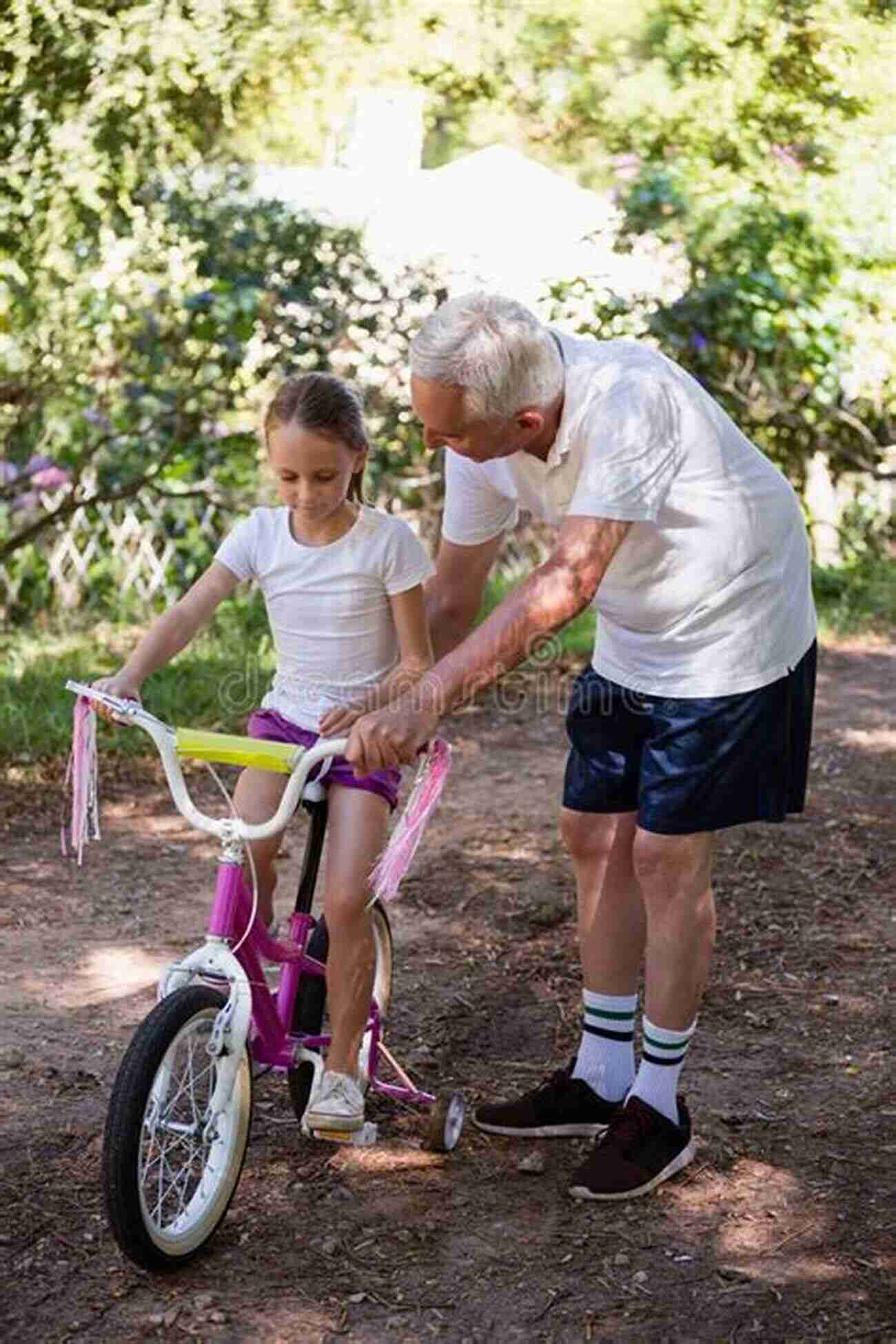 Grandpa Teaching His Granddaughter How To Ride A Bike In The Park Over Grandpa S Shoulder: Short Stories: A Family Of 12: The Growing Up Years (Over Grandpa S Shoulder: Stories From The Past 1)