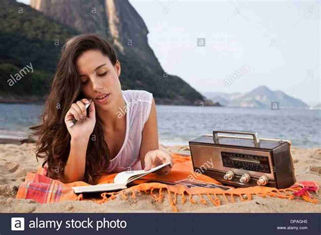 Young Woman Sitting On A Beach, Writing In Her Notebook While Enjoying The View Get Great Trips For Free: Make Travel Writing Work For You